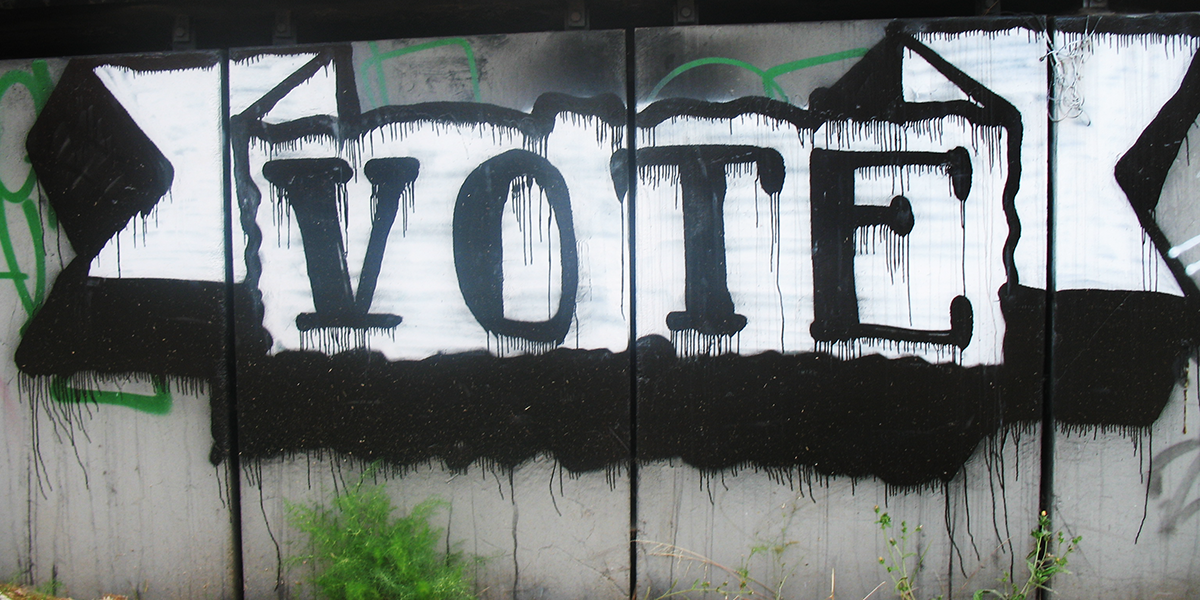 Photo of graffiti art with word VOTE